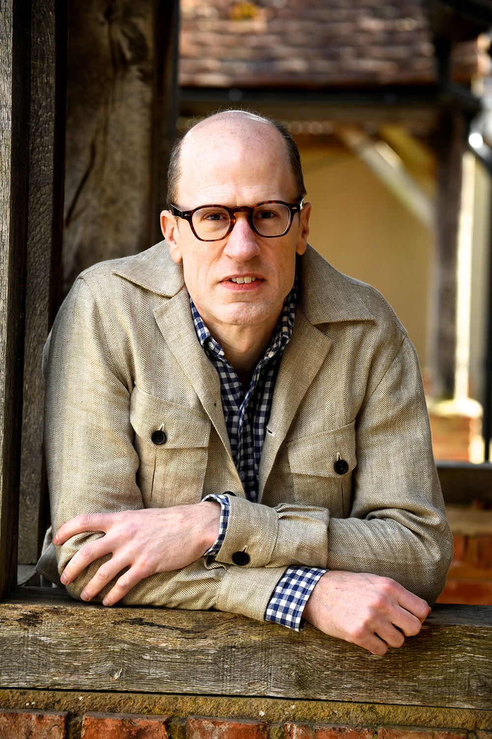 Outdoors portrait of Nick Bostrom in a wooden structure